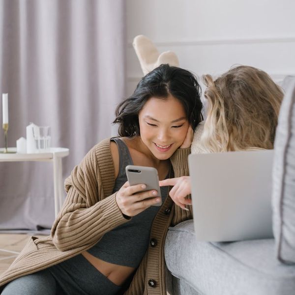 Person working on a laptop in a comfortable home office setting.